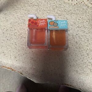 Fresh Juice 2 Pack of a women’s Lip Oil Cherry and Orangee Scented